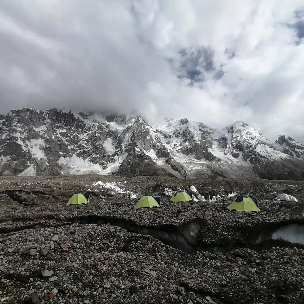 Camp set up on glacial moraine under cloud