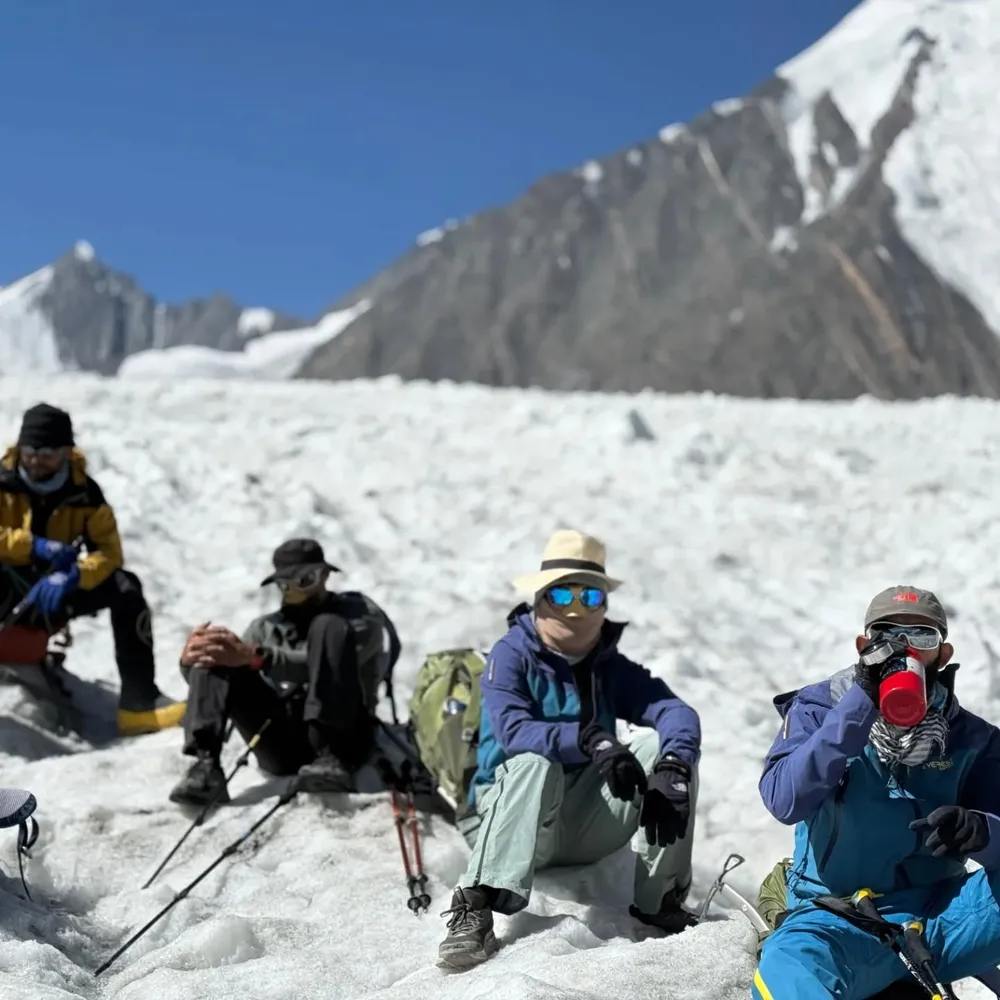 The trekking team resting together on the glacier