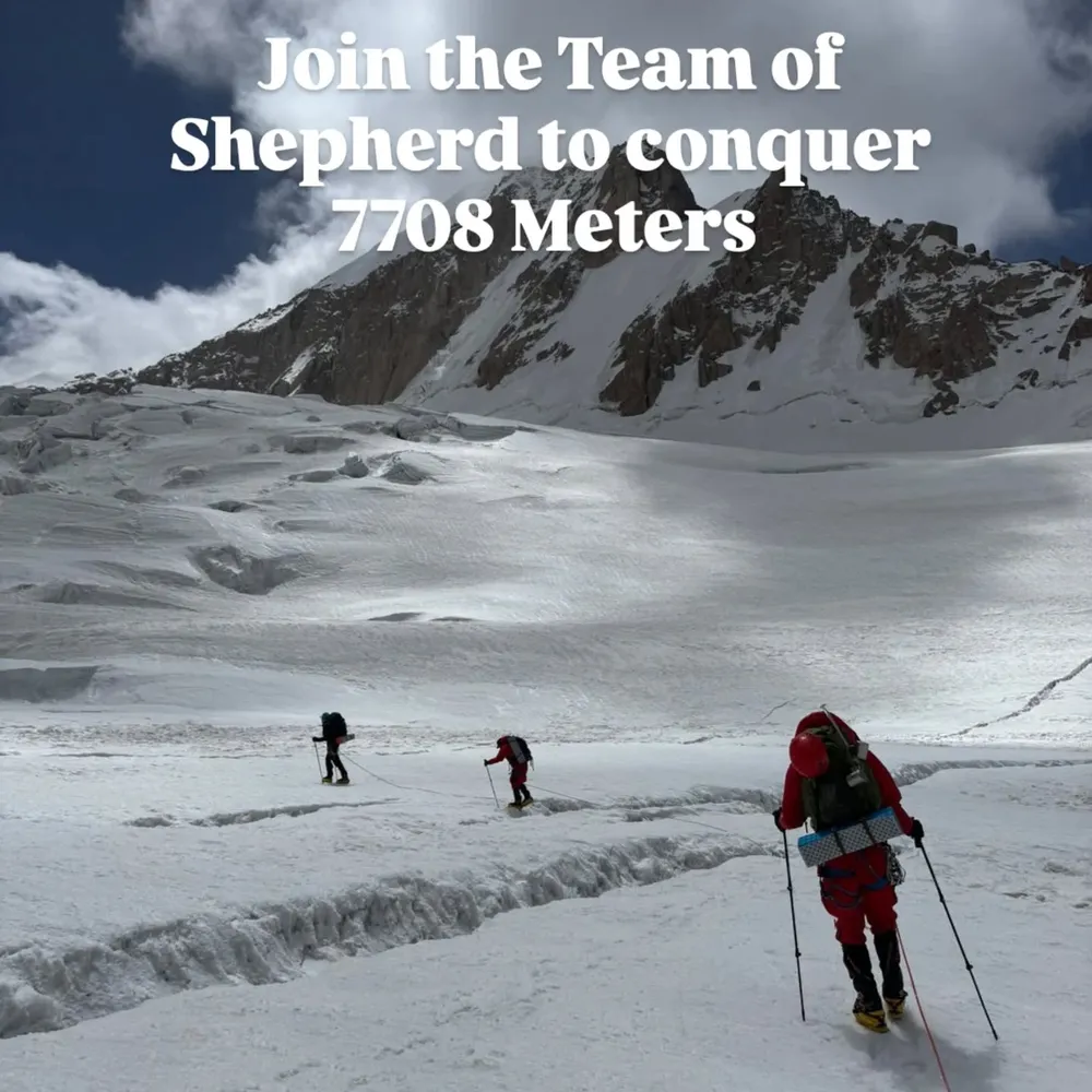 A roped team ascending a snow slope