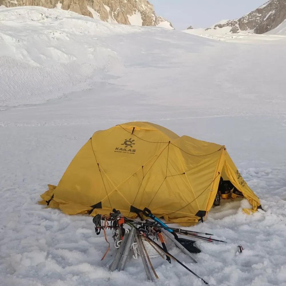 A single tent pitched in deep snow