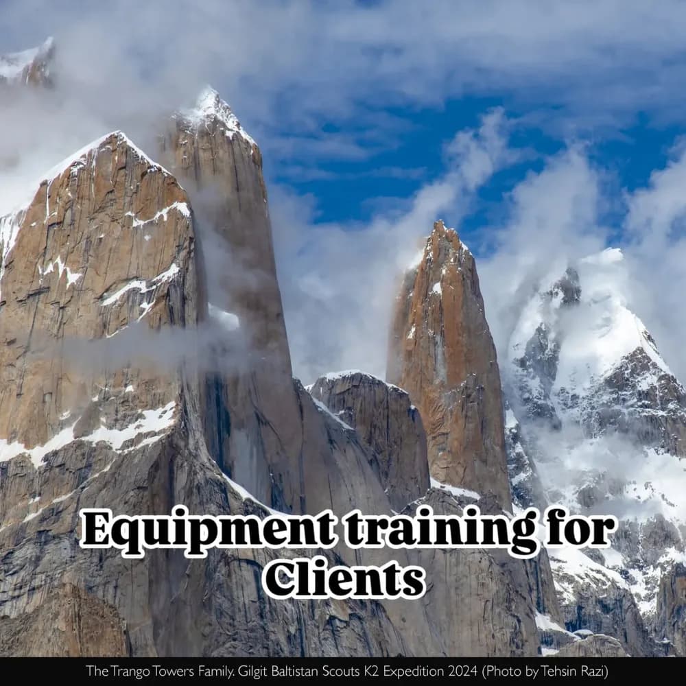 The granite spires of the Trango Towers against a blue sky